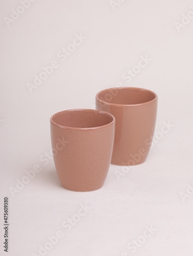 brown ceramic cup on a light background