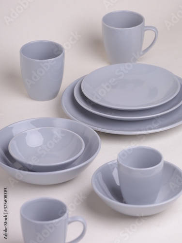 set of gray ceramic dishes on a light background