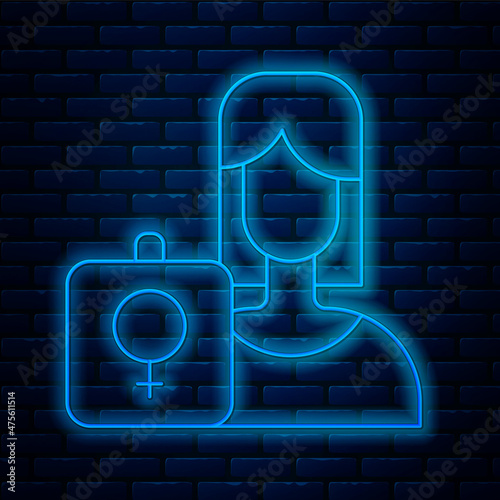 Glowing neon line Female movement, feminist activist with banner and placards icon isolated on brick wall background. Feminist rights movement, feminism sisterhood. Vector