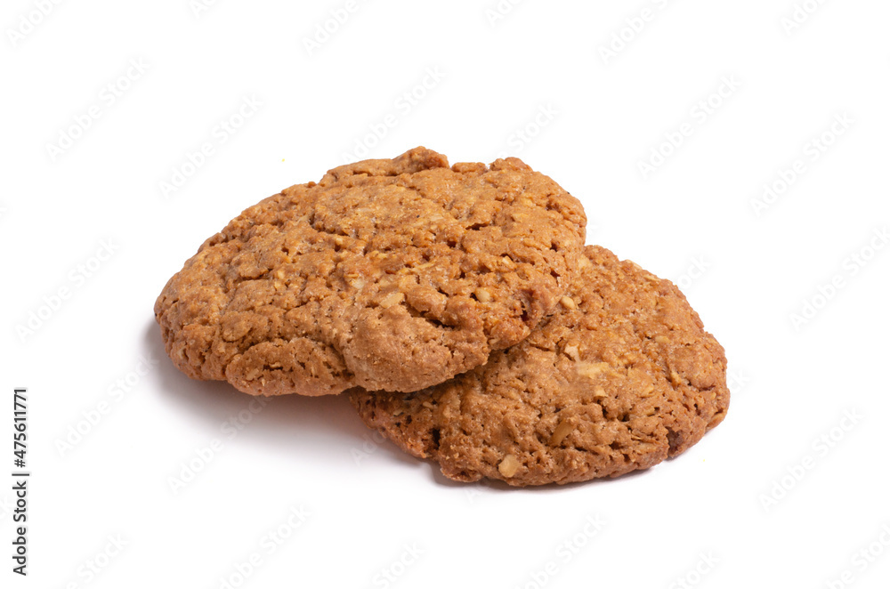 Oat vanilla sugar cookies isolated on white background. Close-up view of brown yellow snacks. Macro shot of beige biscuit cakes for your design Oat vanilla sugar cookies isolated on white background. Close-up view of brown yellow snacks. Macro shot of beige biscuit cakes for your design
