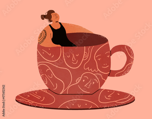 Woman inside a big patterned cup photo