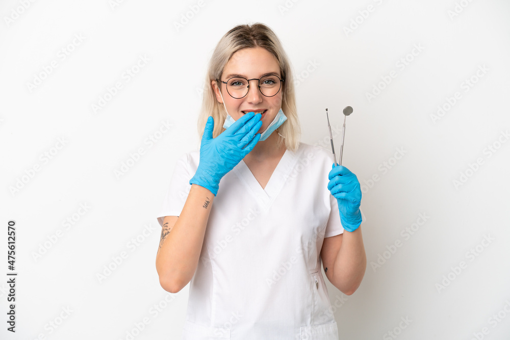 Dentist caucasian woman holding tools isolated on white background happy and smiling covering mouth with hand Dentist caucasian woman holding tools isolated on white background happy and smiling covering mouth with hand