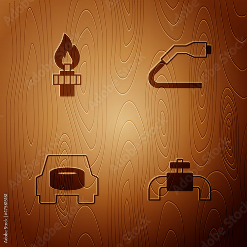 Set Metallic pipes and valve, Oil rig with fire, Spare wheel in the car and Electrical cable plug charging on wooden background. Vector
