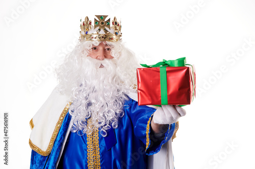 A magician with a present on a white background