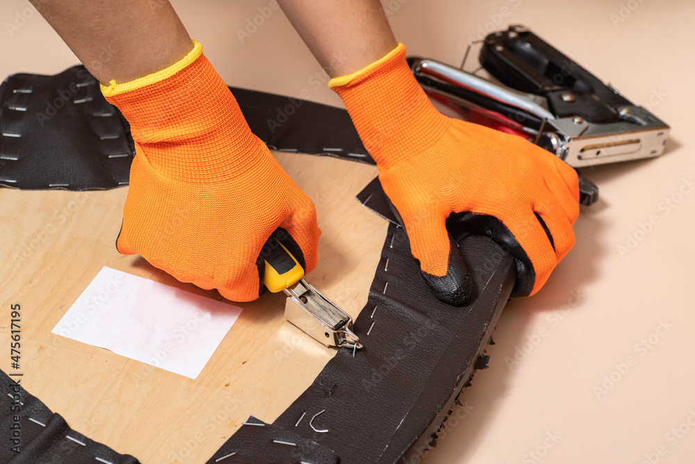 Removing of the staples for replacing of the chair seat upholstery