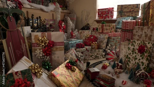 Big pile of Christmas presents with train running through them. 4k.