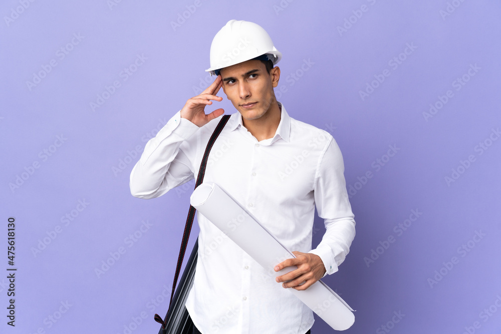 Young architect man isolated on background having doubts and thinking