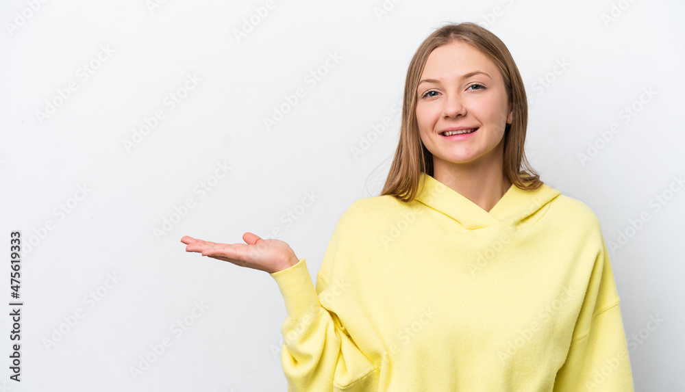Young Russian woman isolated on white background holding copyspace imaginary on the palm to insert an ad Young Russian woman isolated on white background holding copyspace imaginary on the palm to insert an ad