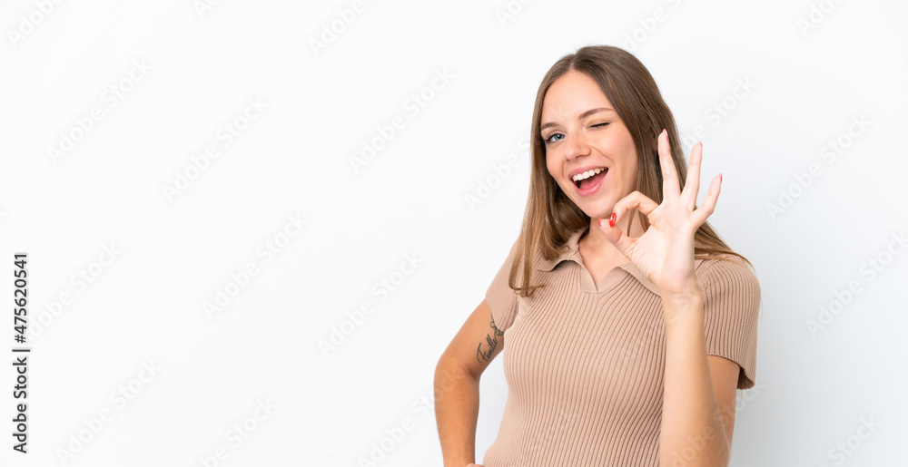 Young Lithuanian woman isolated on white background showing ok sign with fingers Young Lithuanian woman isolated on white background showing ok sign with fingers