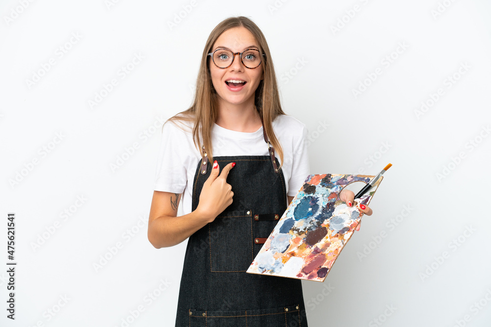 Young artist Lithuanian woman holding a palette isolated on white background with surprise facial expression Young artist Lithuanian woman holding a palette isolated on white background with surprise facial expression