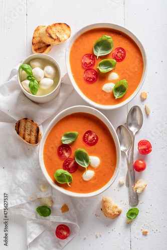 Vegan creamy tomato soup made of cherry tomatoes and basil.