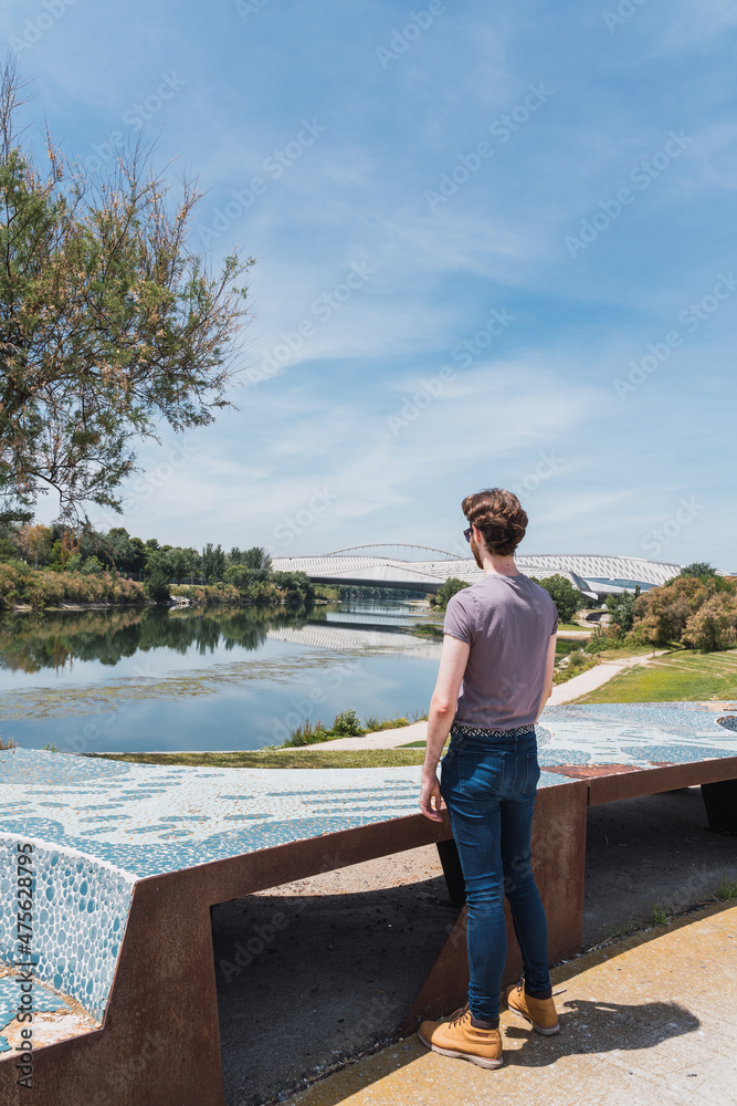 man looking at the river