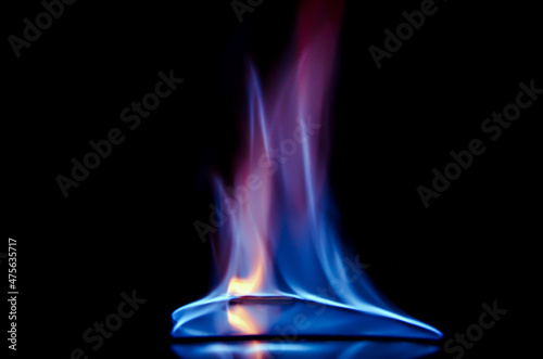 Colorful fire. Blue fire flame on the black background abstract.