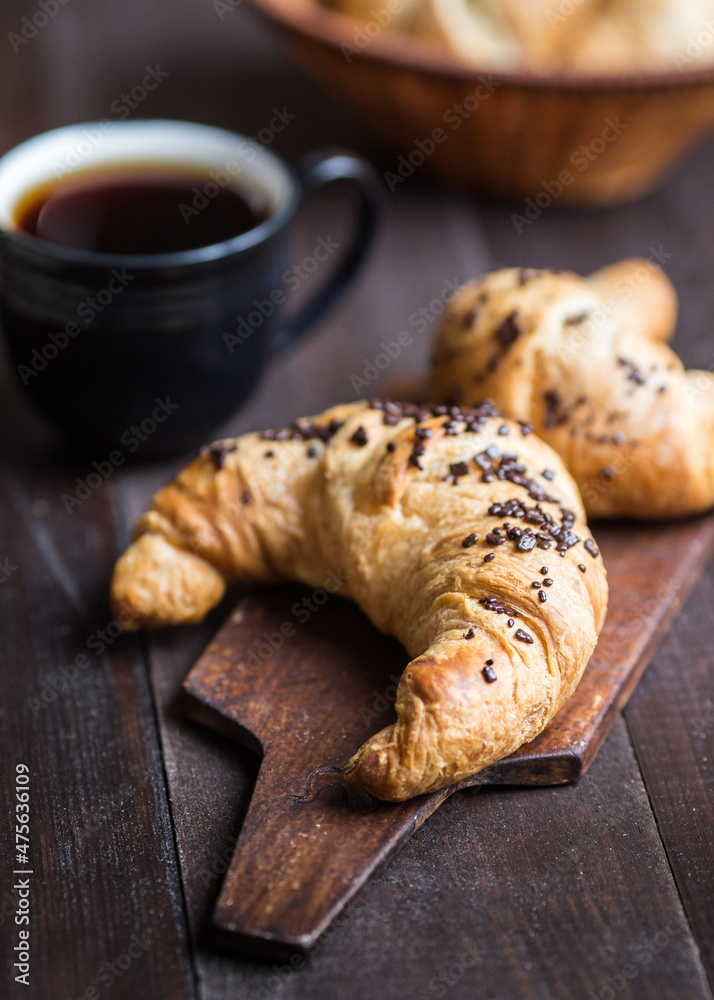 chocolate croissant on a wooden board