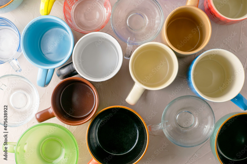 empty mugs of different shapes and sizes on the table empty mugs of different shapes and sizes on the table