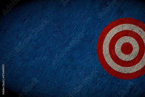 target painted on blue concrete wall, business success concept