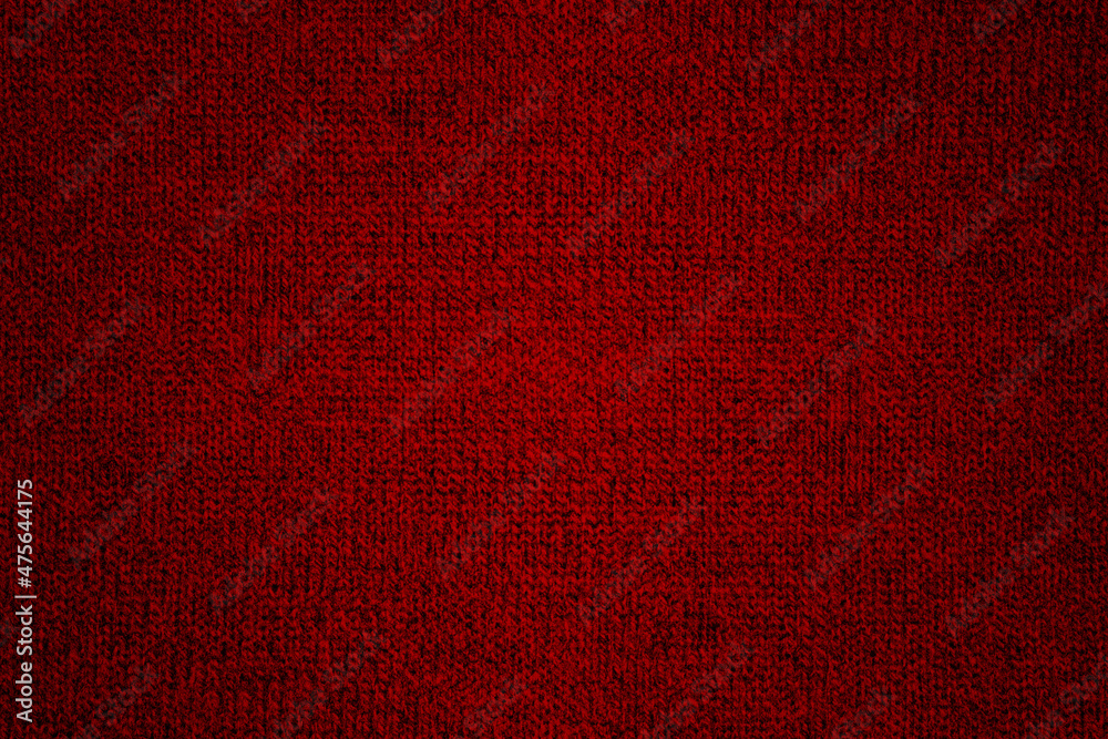 Fototapeta premium Red knitted wool fabric texture background with grunge