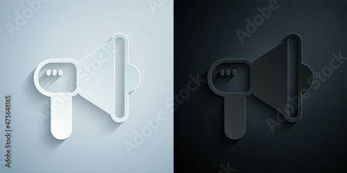 Paper cut Megaphone icon isolated on grey and black background. Speaker sign. Paper art style. Vector
