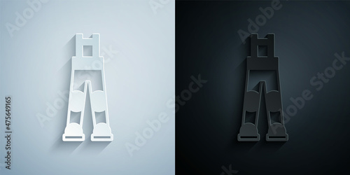 Paper cut Fisherman rubber pants icon isolated on grey and black background. Paper art style. Vector
