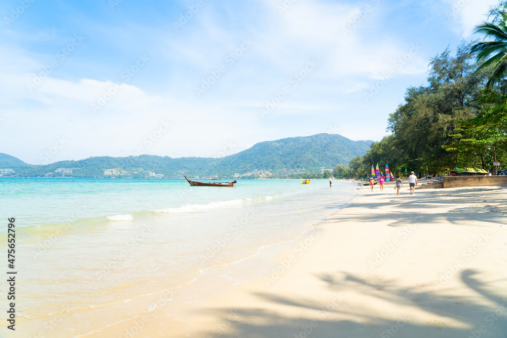 People relax on beach holiday vacation. Family trip swimming in sea water happy and fun. Coconut trees seaside mountain background.