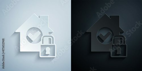 Paper cut House under protection icon isolated on grey and black background. Home and lock. Protection, safety, security, protect, defense concept. Paper art style. Vector