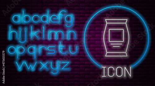 Glowing neon line Fertilizer bag icon isolated on brick wall background. Neon light alphabet. Vector
