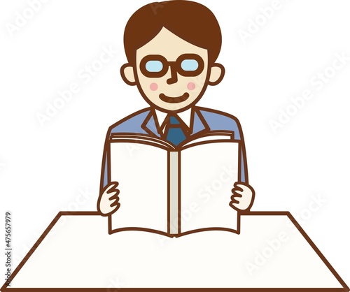 本を読むスーツを着た男性。