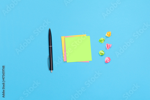 Fototapeta Naklejka Na Ścianę i Meble -  Sticky notes and a pen on the table