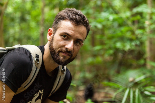 A happy tourist in the rainforest of Indonesia