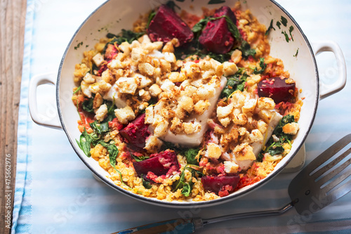 Cod fish with breadcrumbs, beetroot, spinach and lentils
