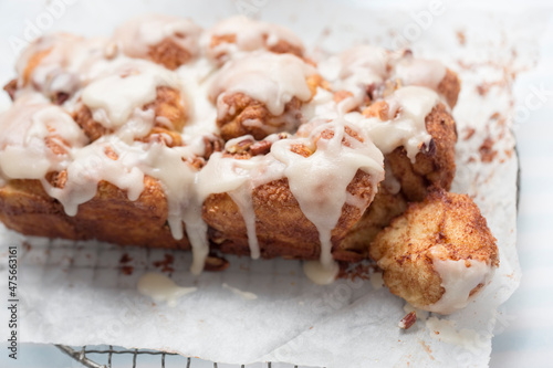 Monkey yeast bread with cinnamon and pecans, vanilla icing