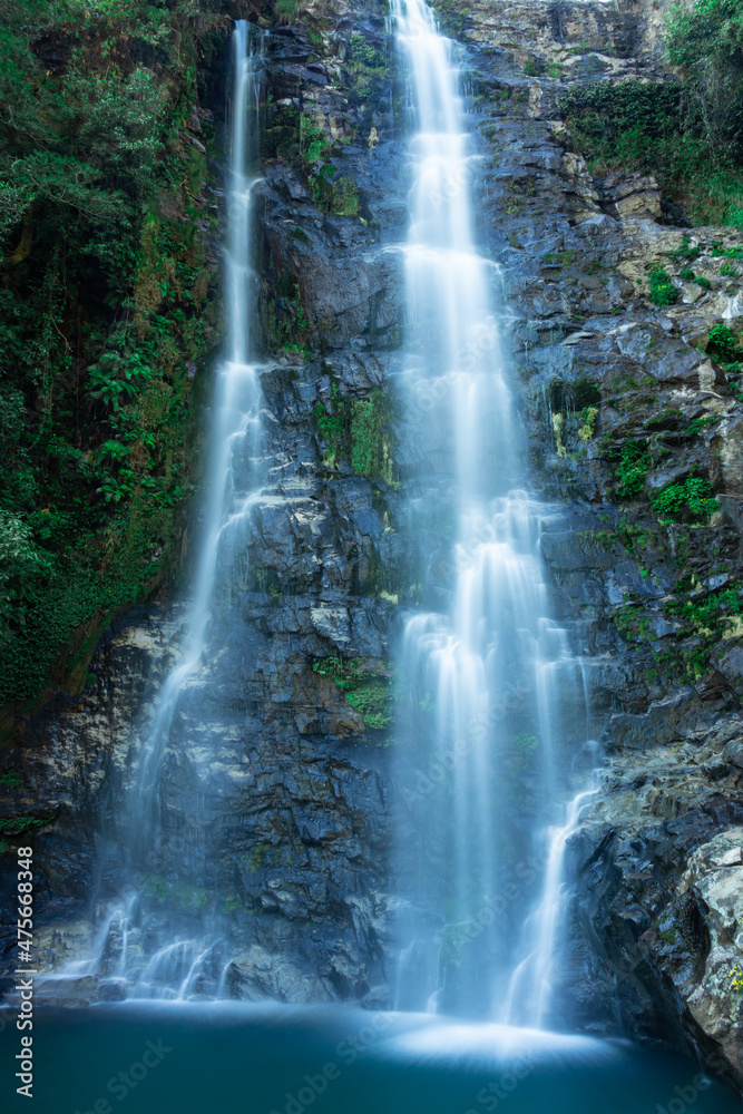 waterfall flowing streams falling from mountain with calm blurred water surface long exposure shot waterfall flowing streams falling from mountain with calm blurred water surface long exposure shot