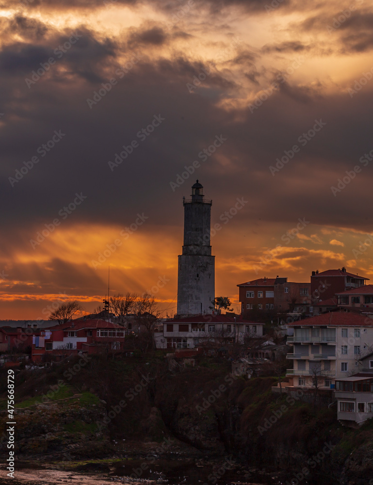 Light house at Rumelifeneri marina in Istanbul. Blue sky and natural white clouds. Sunrise 