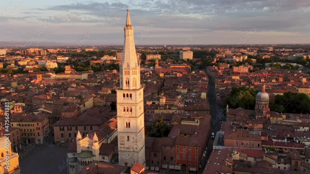 aerial shot drone of modena historic city center at dawn,panoramic view of downtown cathedral and ghirlandina landmark at sunrise 4k aerial shot drone of modena historic city center at dawn,panoramic view of downtown cathedral and ghirlandina landmark at sunrise 4k