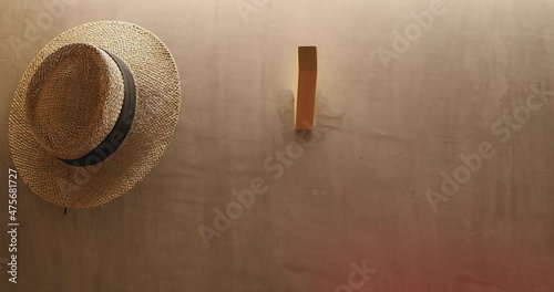 4K Close up slow motion hand take the hat from the wall. Concept of lifestyle and vacation.
