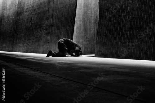Fotobehang Black and white Photograph of Muslim man praying in Mosque
