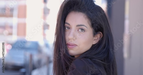 Wallpaper Mural young moroccan woman turns and stares at camera - beauty, seduction Torontodigital.ca