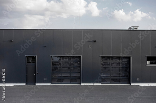 The car service building with two entrances to a garage
