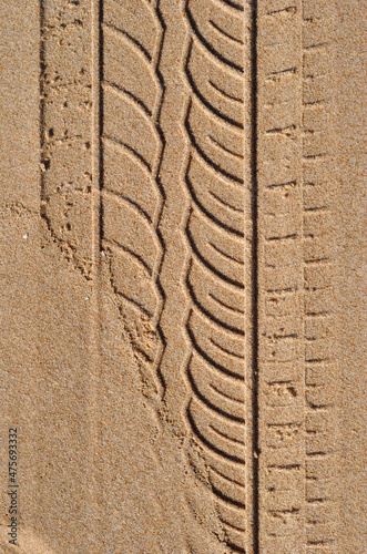 Close Up of Tyre Pattern on Sandy Beach 