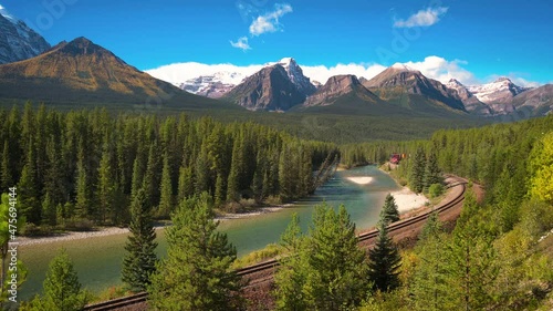 Train passing through Morant's Curve in bow valley, Canada