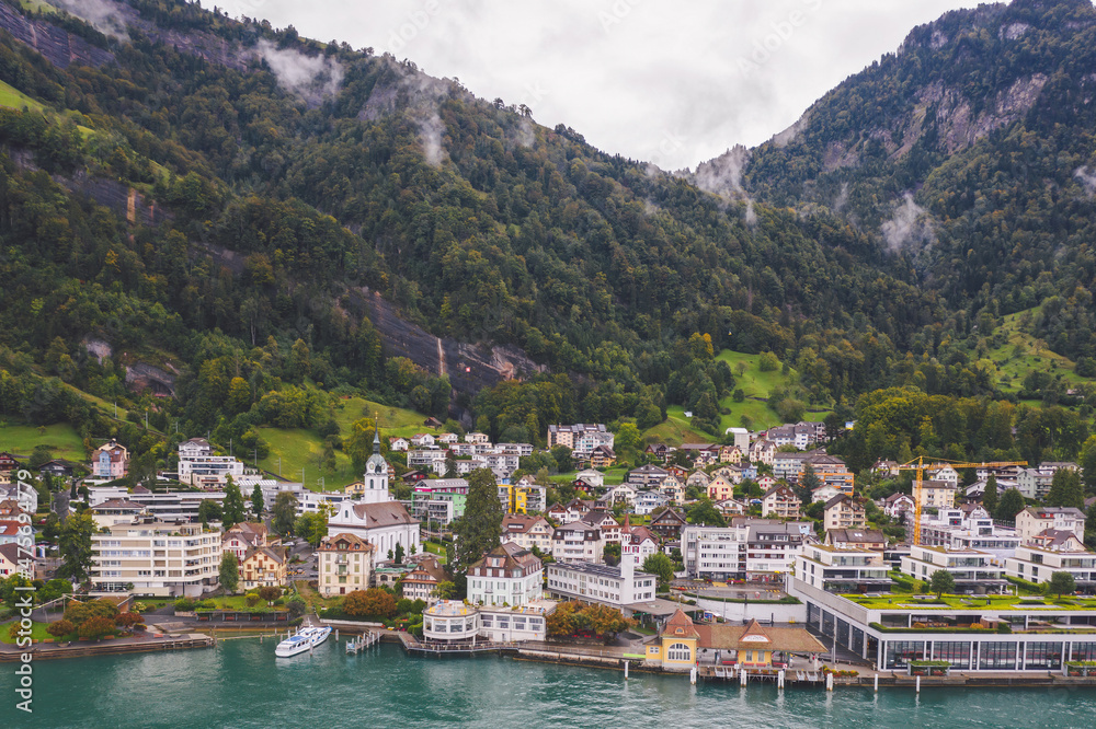 Aerial view on Vitznau municipality (Lucerne, Switzerland) and its main landmark - railway to the Rigi mountain (Rigi Bahnen) in Swiss Alps.