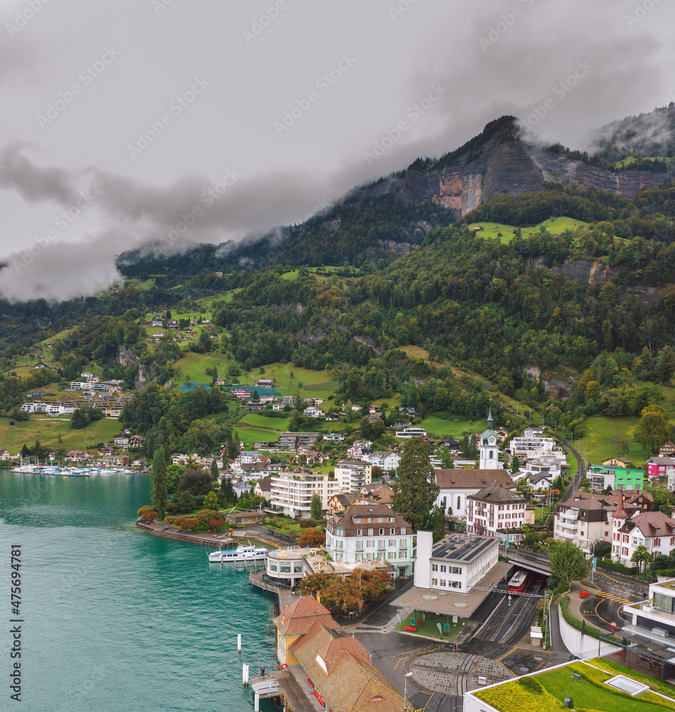 Aerial view on Vitznau municipality (Lucerne, Switzerland) and its main landmark - railway to the Rigi mountain (Rigi Bahnen) in Swiss Alps.