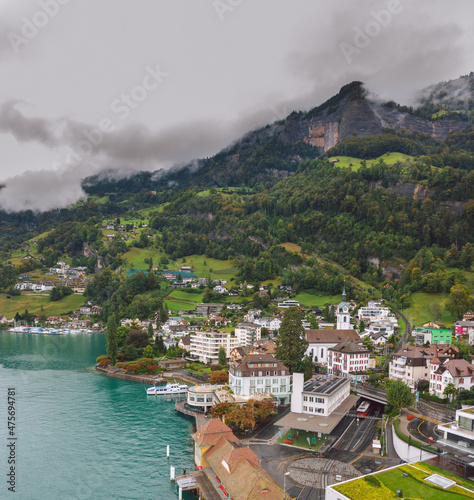 Obraz na płótnie Aerial view on Vitznau municipality (Lucerne, Switzerland) and its main landmark - railway to the Rigi mountain (Rigi Bahnen) in Swiss Alps. w salonie