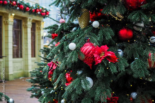 Beautifully decorated Christmas tree at the fair. Festive decor for the new year photo