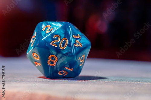 Obraz na plátně Close-up image of a blue role-playing gaming die with 20 sides