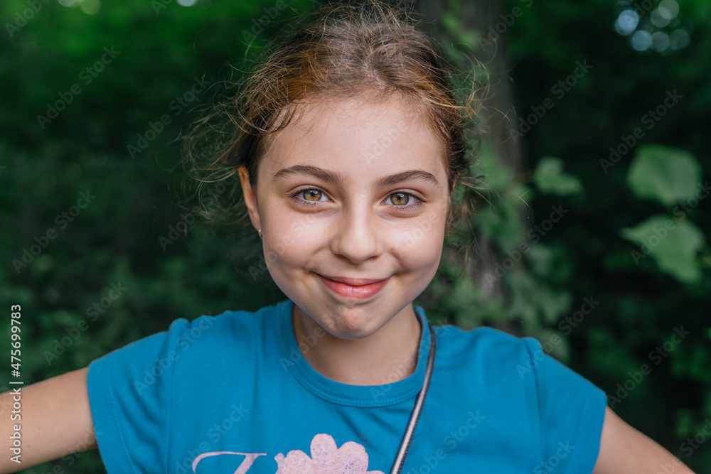 Portrait of a ten-year-old russian girl smiling to the camera Portrait of a ten-year-old russian girl smiling to the camera
