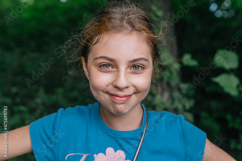 Photography Portrait of a ten-year-old russian girl smiling to the camera