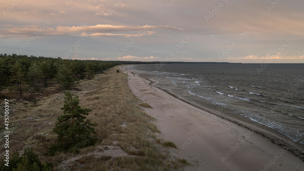 Coastal panorama at Lyckesand beach with ocean on the island of Oland in the east of Sweden from above in sunset.