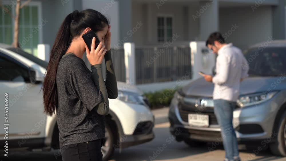 stress woman motorists calling insurance company on mobile phone to responsibility for car accident traffic collision after a car accident on the road with driver man