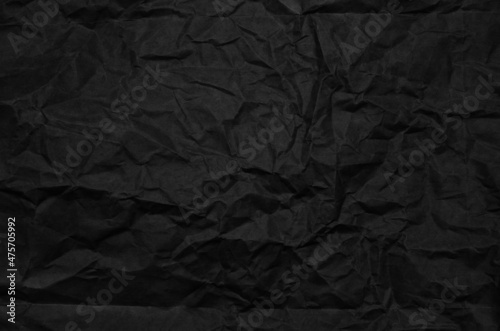 Crumpled black paper for background usage
